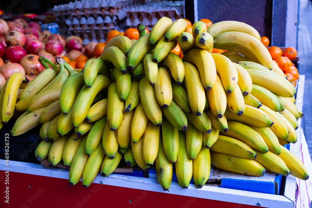 Fresh bananas on counter in food market. High quality photo