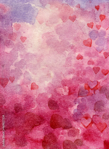 Watercolor background of hearts. Small pink hearts on an abstract watercolor background. Romantic background for design and creativity.