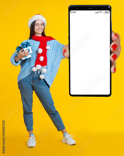 Hand phone. Christmas woman...