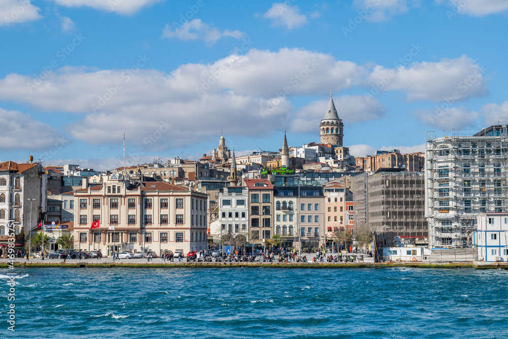 Istanbul cityscape with Galata tower in the background. City view of Karakoy and Galata district of Istanbul seen from Bosphorus, the strait of Istanbul.