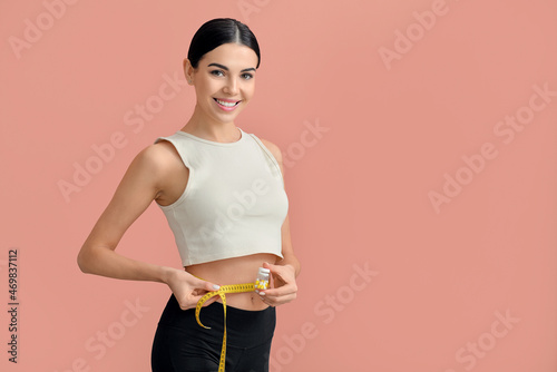 Sporty woman with pills and...