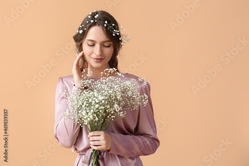 Pretty young woman with bou...