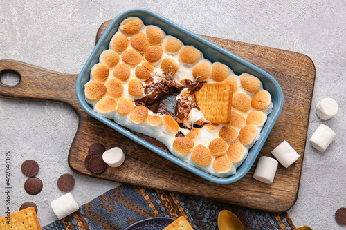 Baking dish with tasty S'mores dip on grey background photo