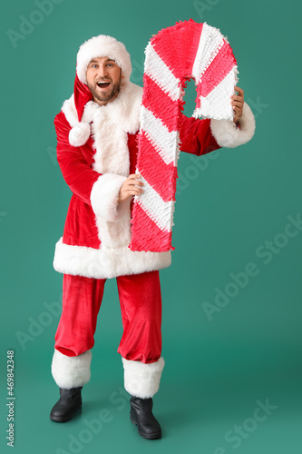 Happy Santa Claus with cand...