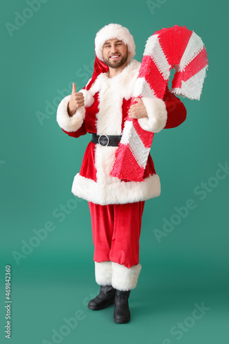 Smiling santa claus giving ...
