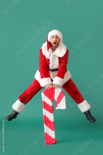 Santa Claus with candy cane...