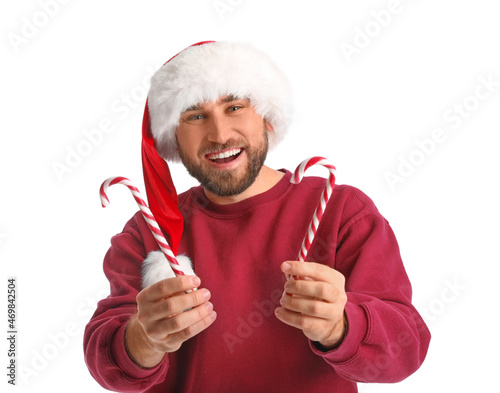 Handsome man in Santa hat w...