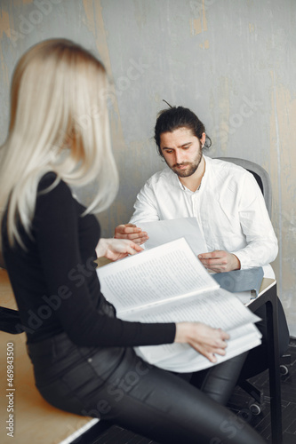 Stylish businessman with woman working at the office