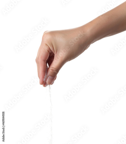Hand holding sea salt on white background