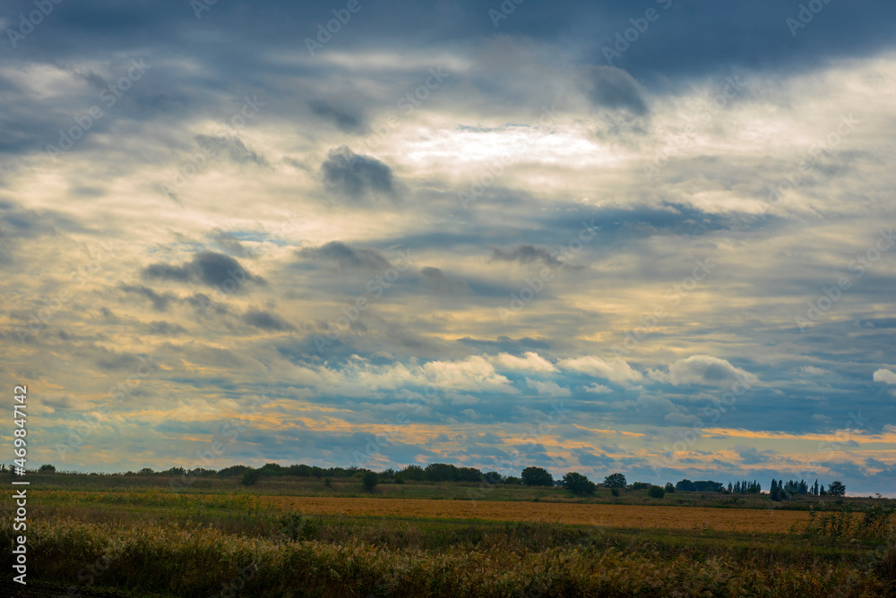 sunrise and clouds over the field in  autumn