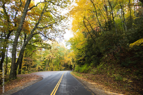 Two lane road in the Great Smoky Mountains National Park with fall foliage