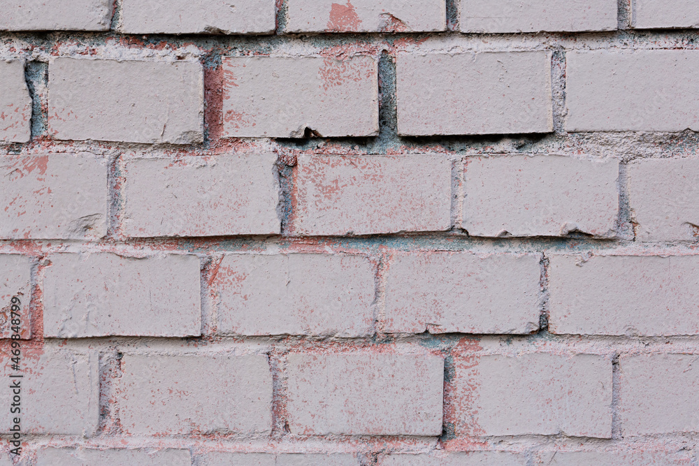 Fototapeta premium Old painted brick wall. Texture of rough brickwork. Masonry background.