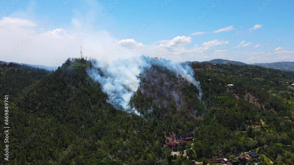 custom made wallpaper toronto digitalFire in the mountains, human destruction of wildlife and nature, burning mountain and air pollution