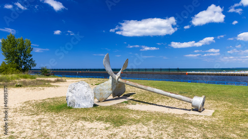 Old boat propeller along the lake Michigan shore in Douglas park, Manistee, Michigan photo