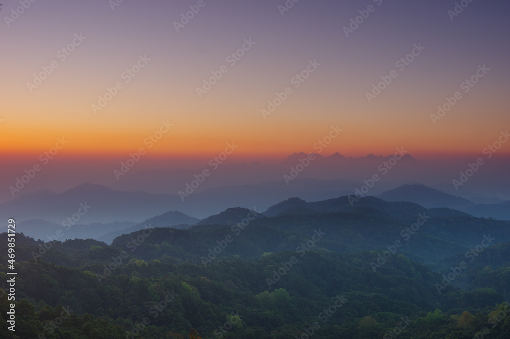 Aerial View of Doi chiang dao mountains in the morning and the sea of mist, Doi Kham Fa. Chiang Mai Province, Thailand. Pink cherry blossom.