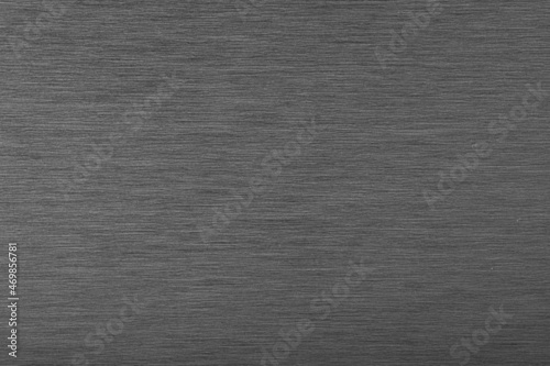 Brushed black silver Stainless steel hair line plate aluminium metal background texture horizontal. Platinum silver wallpaper concept.