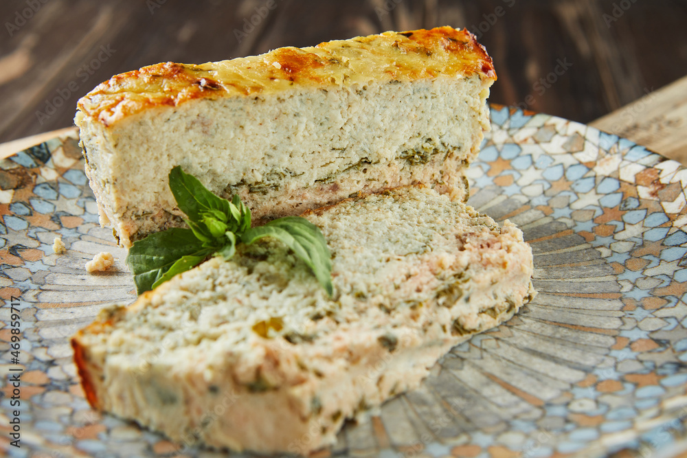 Salmon and dennis pate, sliced slices on plate of basil. French gourmet cuisine Salmon and dennis pate, sliced slices on plate of basil. French gourmet cuisine