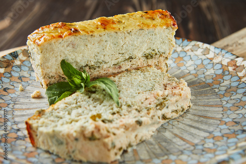 Salmon and dennis pate, sliced slices on plate of basil. French gourmet cuisine photo