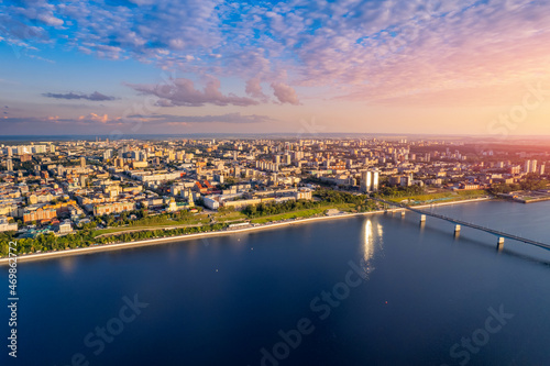 Fototapeta Naklejka Na Ścianę i Meble -  Aerial top view panorama city Perm and central embankment of Kama river Russia, sunset drone photo