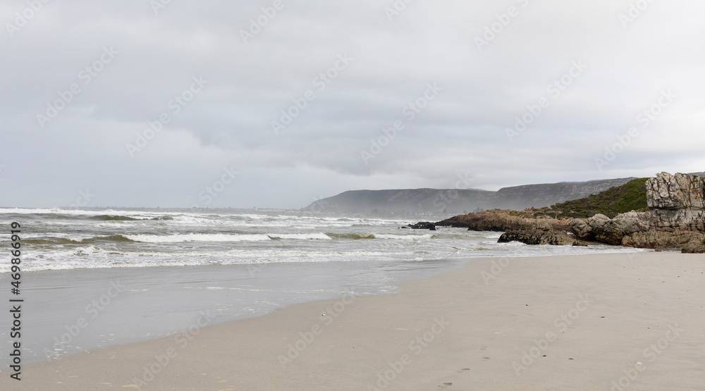 The jagged rocks and coastline of the Atlantic coast at Grotto Beach, a wide beach near Hermanus. The jagged rocks and coastline of the Atlantic coast at Grotto Beach, a wide beach near Hermanus.