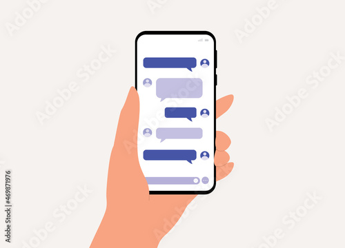 A Person's Hand Holding Smartphone With Online Messaging.