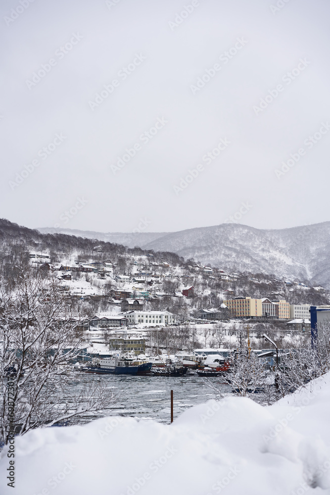 Petropavlovsk Kamchatsky city in the winter at snowy weather. Kamchatka peninsula, Russia Petropavlovsk Kamchatsky city in the winter at snowy weather. Kamchatka peninsula, Russia