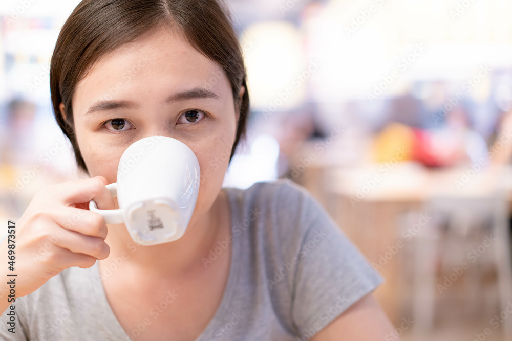 Beautiful Asian woman enjoy drinking a coffee in cafe and restaurant. Beautiful Asian woman enjoy drinking a coffee in cafe and restaurant.