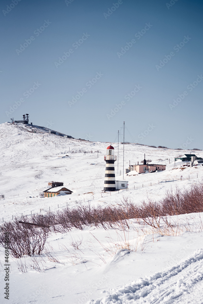 Black and white lighthouse in the winter