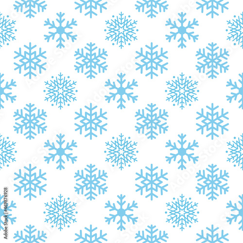 Seamless winter background of snowflakes arranged in regular rows. Winter fairy tale, Christmas symbol.
