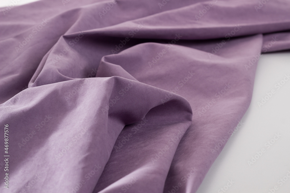 Violet fabrics folded top view on a white background. Violet textile Violet fabrics folded top view on a white background. Violet textile