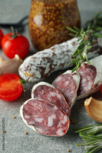 Сoncept of tasty food with salami sausage, close up