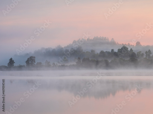 Fog over lake at sunrise