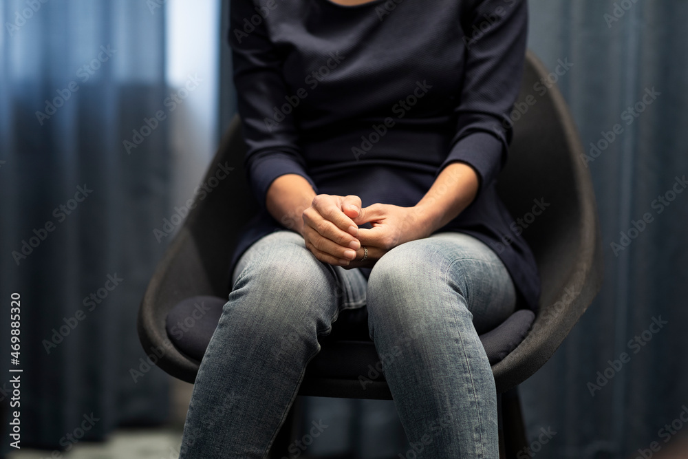 Mid section of woman sitting during meeting Mid section of woman sitting during meeting
