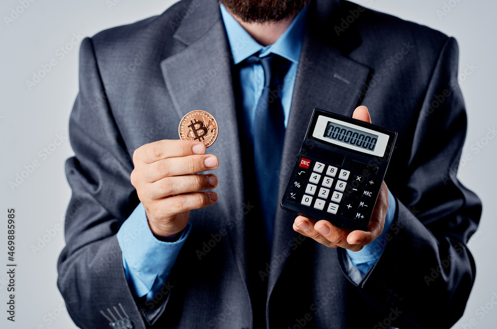 emotional man calculator bitcoin in hand counting finance light background emotional man calculator bitcoin in hand counting finance light background