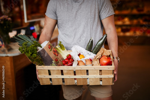 Man doing shopping in shop with organic food