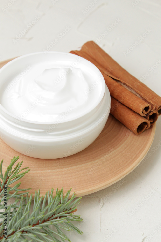 Holistic skincare cosmetic. Cinnamon aromatherapy. Facial moisturizer, dried plant ingredients.