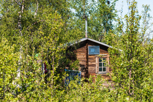 Old wooden cabin with solar panel
