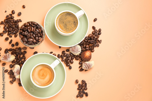 Coffee chocolate. Espresso with froth or macchiato in small cups, sprinkled coffee beans and chocolates. view from above. High quality photo. Copy space