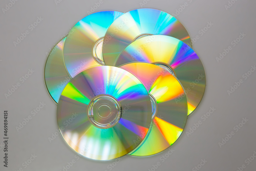 Six CDs DVDs on a gray background. Six CDs DVDs on a gray background.