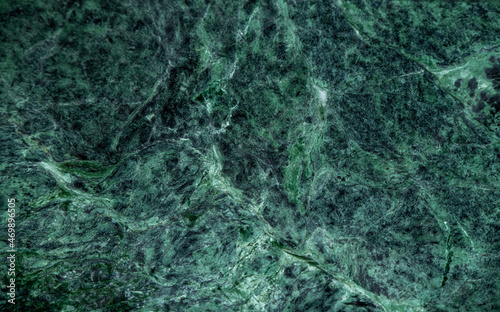 green polished marble with black veins close-up, background image
