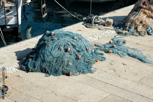Fishing gear, nets and ropes are dried on berth. Sea fishing photo