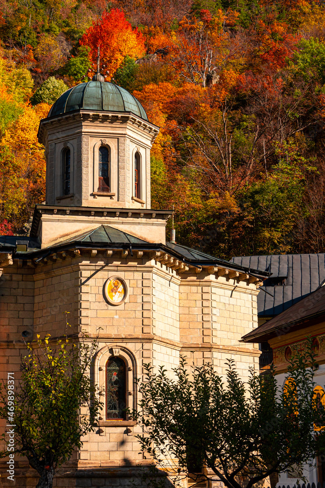 Stanisoara Monastery, built in the 18th century, is a orthodox religious landmark from Cozia Mountains and Romania. Photo taken in the autumn landscape.