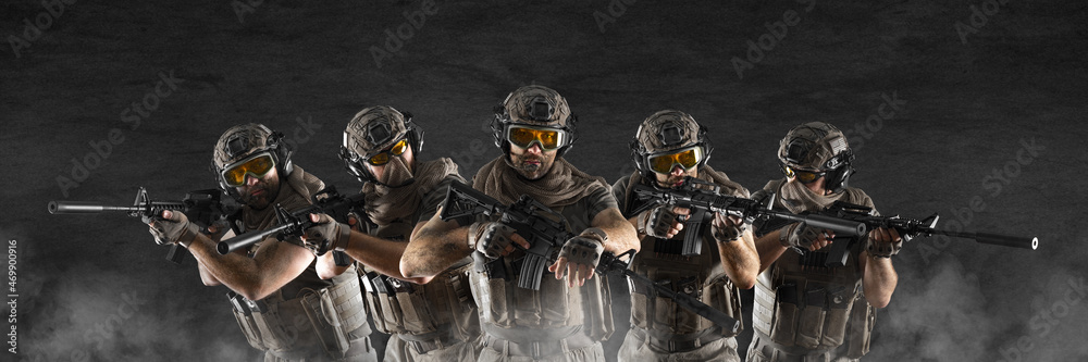 Group of professional special forces soldiers, during a special operation in smoke. Photo format 3x1. Group of professional special forces soldiers, during a special operation in smoke. Photo format 3x1.