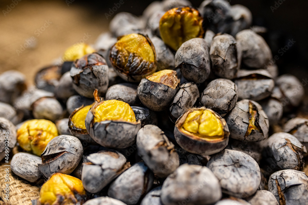 Heap of delicious chestnuts roasted on fire Heap of delicious chestnuts roasted on fire
