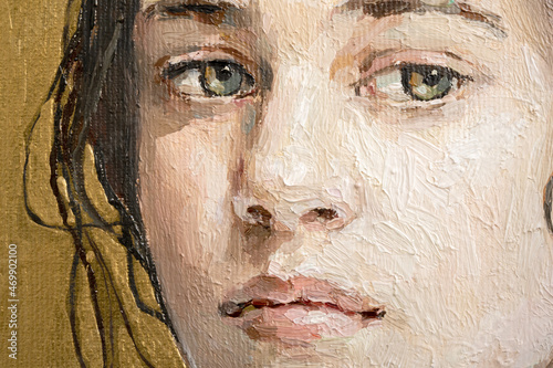 Oil painting. Portrait of a girl on a gold background. The art is done in a realistic manner.