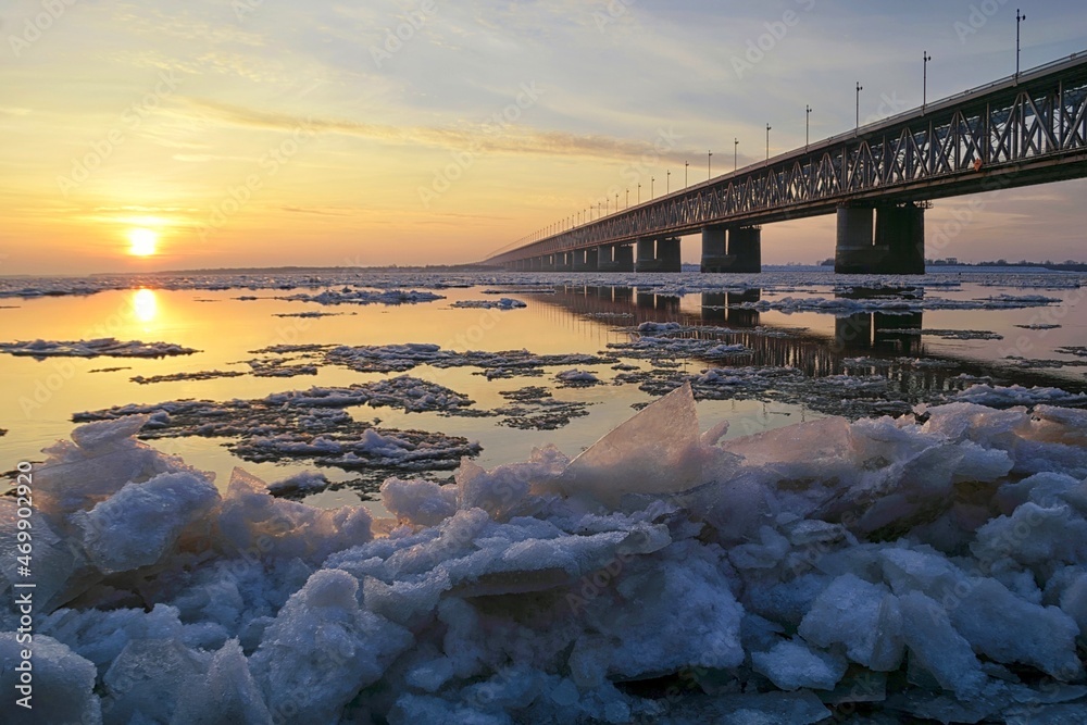 November sunset on the Amur river. Ice drift. Khabarovsk, Amur bridge, Trans Siberian railway. Far East, Russia.