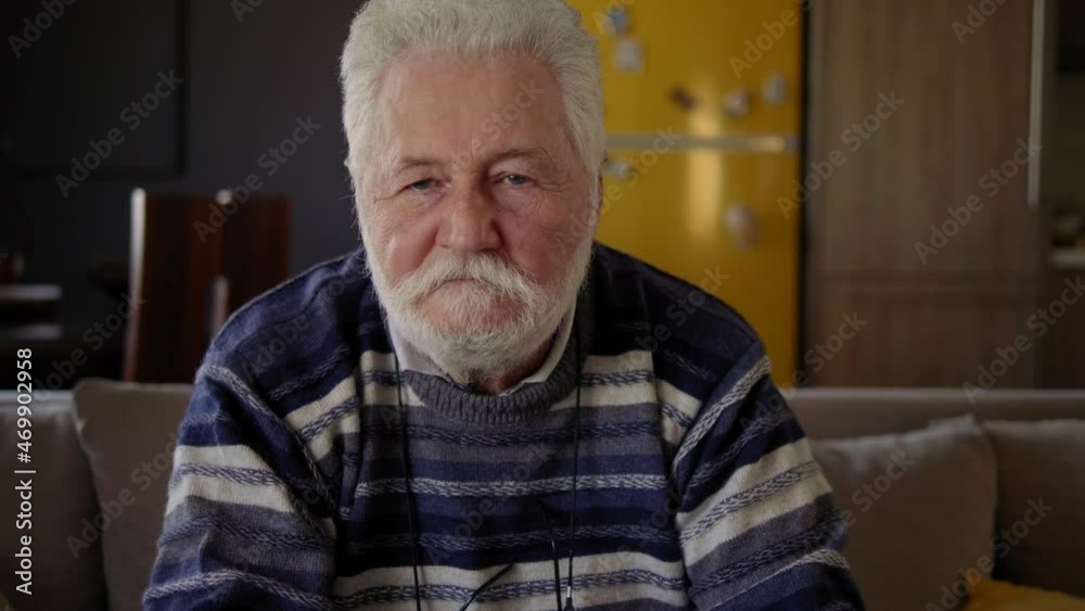 Portrait of serious elderly man looking at the camera Portrait of serious elderly man looking at the camera