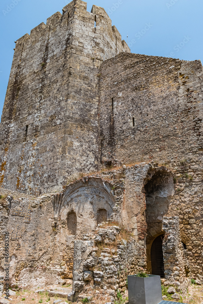 Fototapeta premium Perspective of ruined old chapel wall in Palmela castle with tower, PORTUGAL