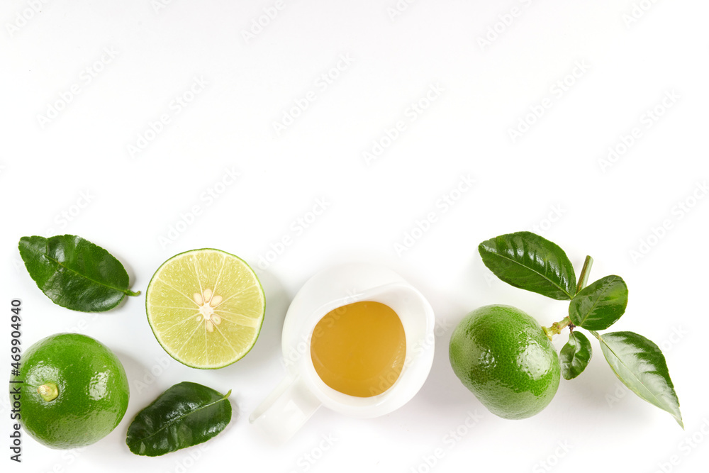 lime with half and leaf isolated on white background. Fresh fruit with leaf. Set or collection. lemon juice and green lemon. Flat lay. It's freshly picked from home growth organic garden. Food concept