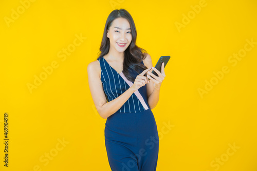 Portrait beautiful young asian woman smile with smart mobile phone